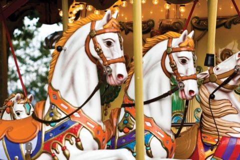 Carousel horses in bright colors at Midway State Park overlooking Chautauqua Lake