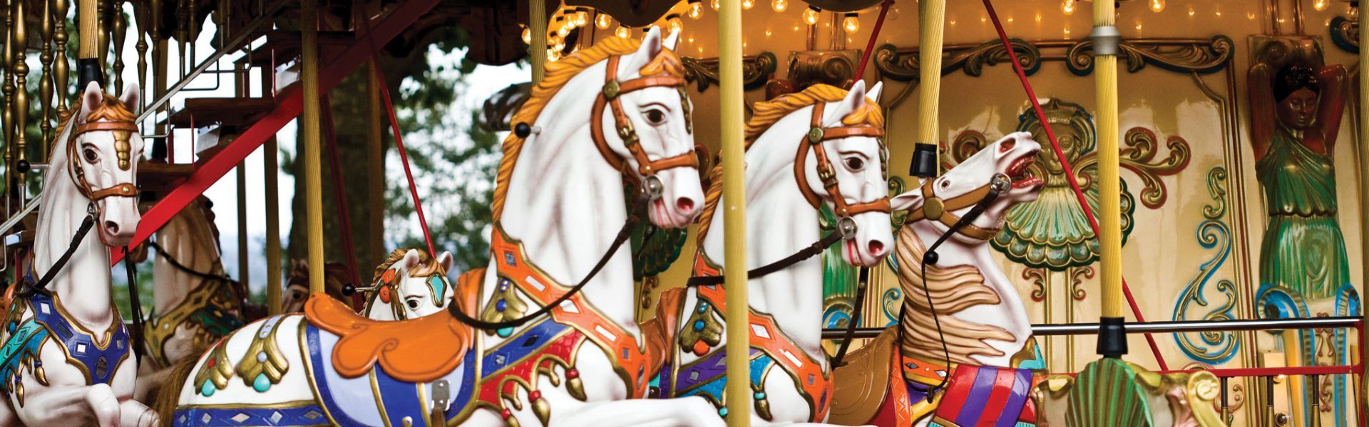 Carousel horses in bright colors at Midway State Park overlooking Chautauqua Lake